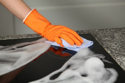 Carpet cleaning technician preparing equipment safely in South Wimbledon