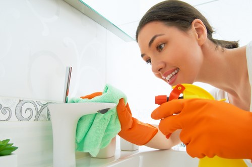 Professional carpet cleaner applying safe cleaning procedures indoors