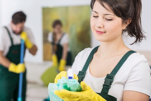 Cleaning technician inspecting carpet condition before treatment